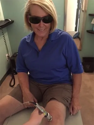 Person Receiving Laser Therapy On Knee