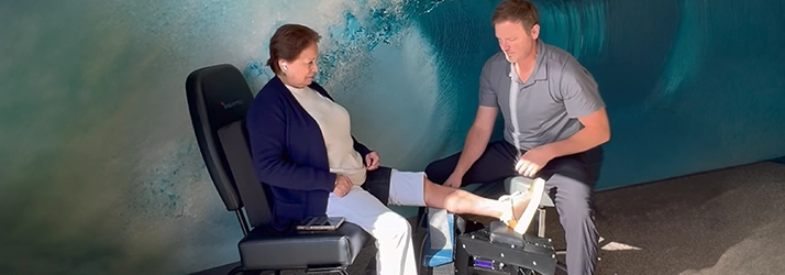 Chiropractor Ron Bittle Consulting With Knee Pain Patient