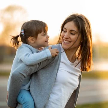 Mother And Daughter Piggyback